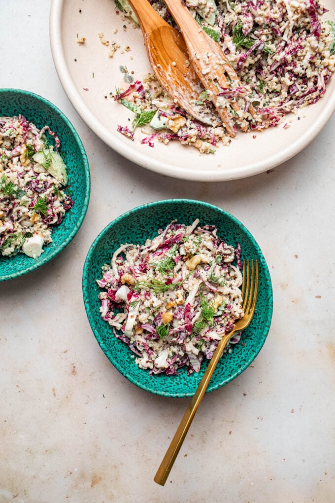 quinoa salad in blue bowls with fork