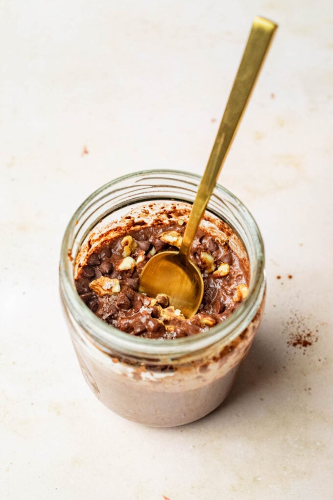 gold spoon in jar of overnight oats