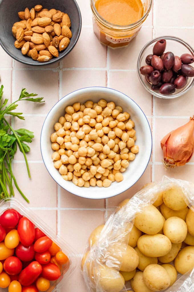 chickpeas and potatoes in bowls with vegetables