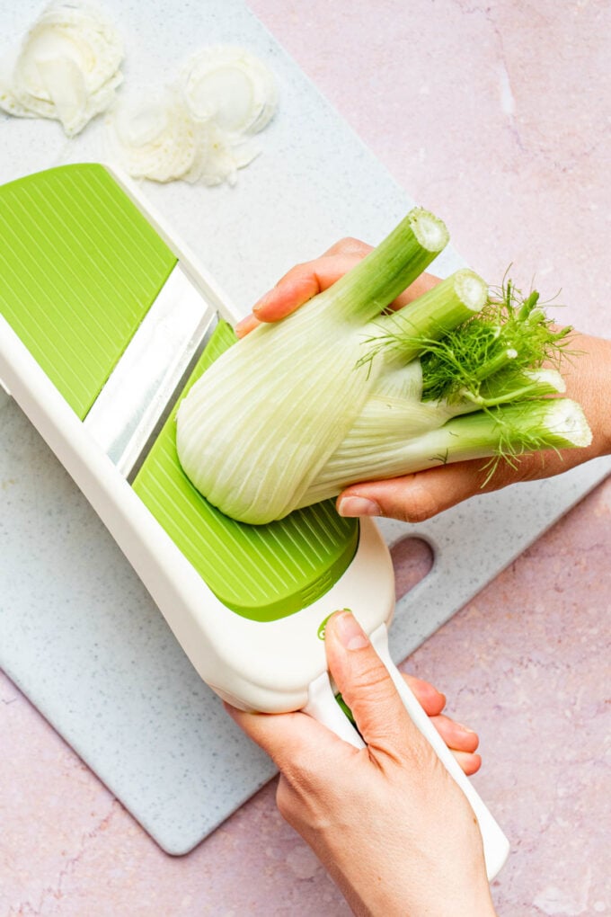 hand slicing fennel on mandolin