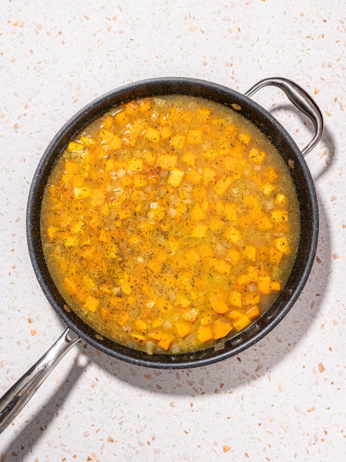 Skillet with water and squash