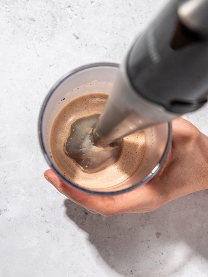 blending hot chocolate in cup