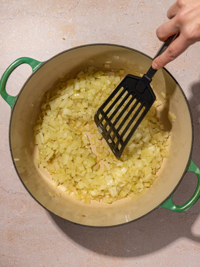 spatula and onions in pot