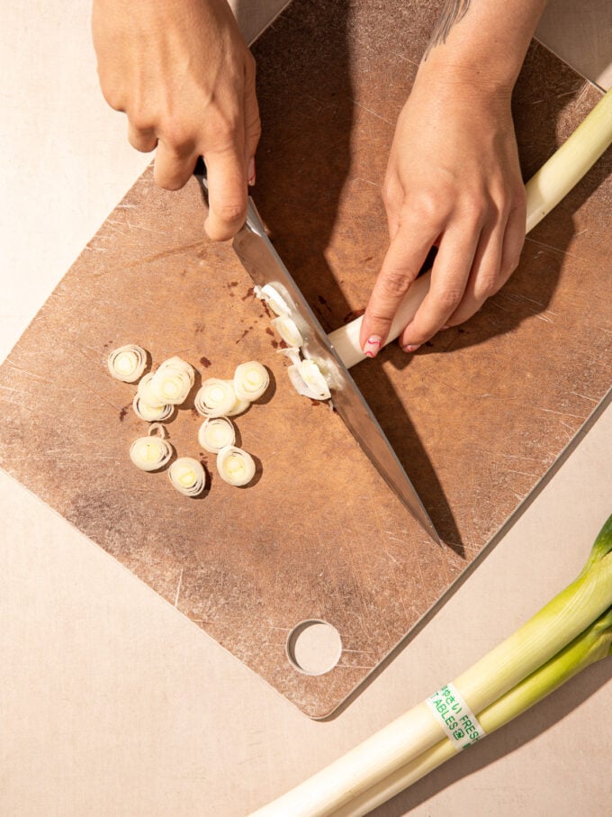 hand slicing leeks