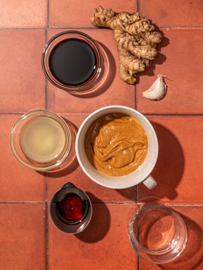 peanut butter, ginger and soy sauce in bowls