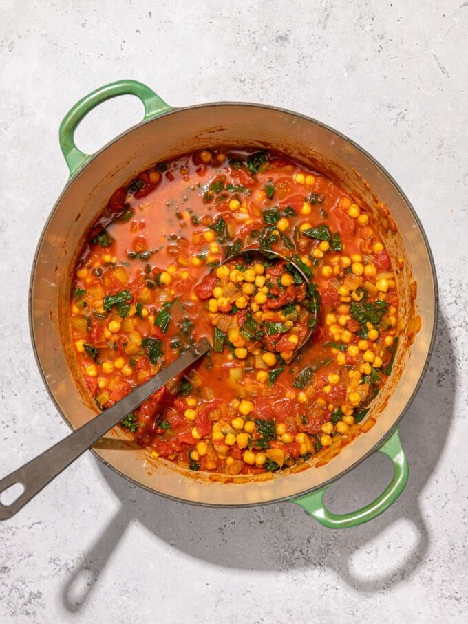 chickpea stew in pot with ladle