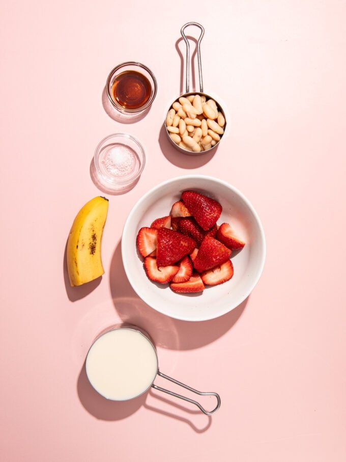 strawberries in white bowl, white beans and banana