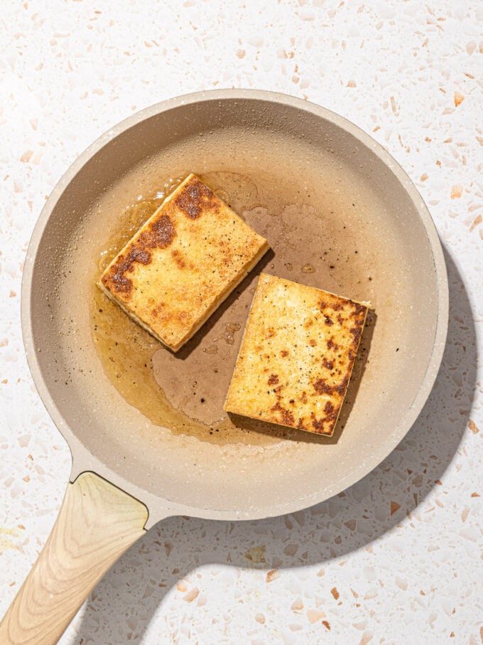 fried tofu in beige skillet