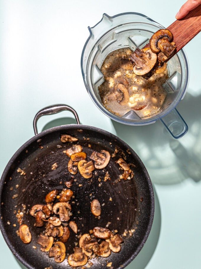 scooping mushrooms into blender