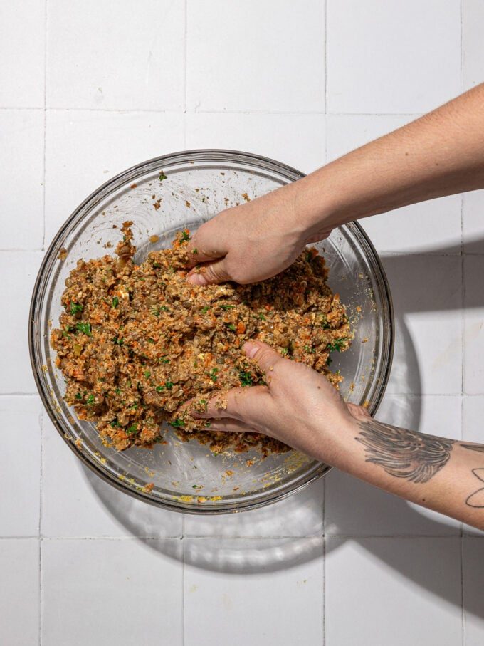 hands mixing vegan meatloaf dough