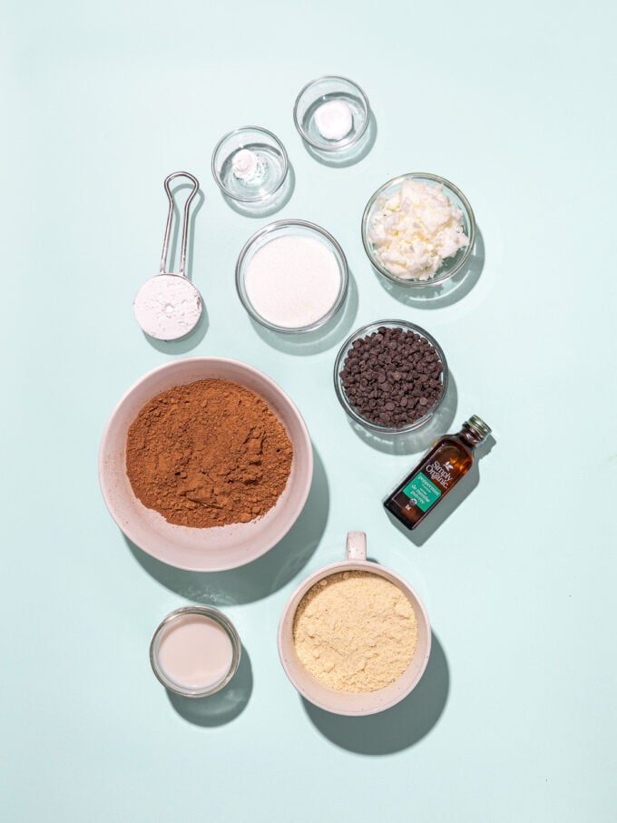 bowls of cocoa, almond flour, coconut oil and sugar