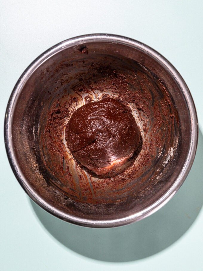 ball of chocolate cookie dough in metal bowl