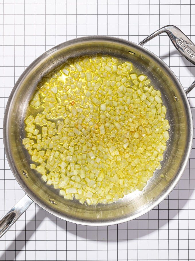 stainless steel skillet with cooked onions