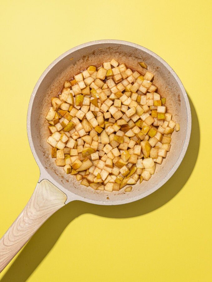 beige skillet with diced sautéed pears