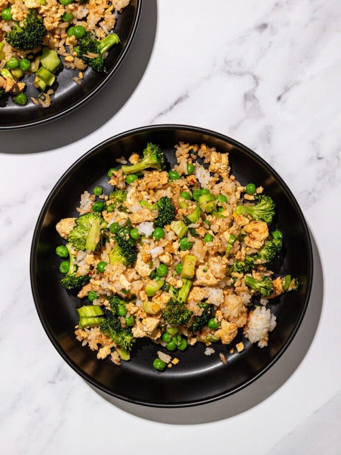 black bowls with broccoli tofu fried rice