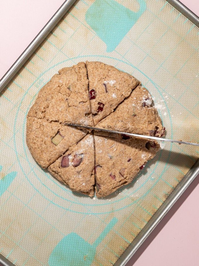 knife slicing scone dough into wedges