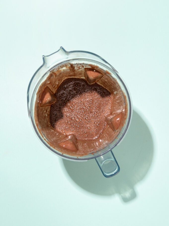 blender with blended black bean smoothie inside